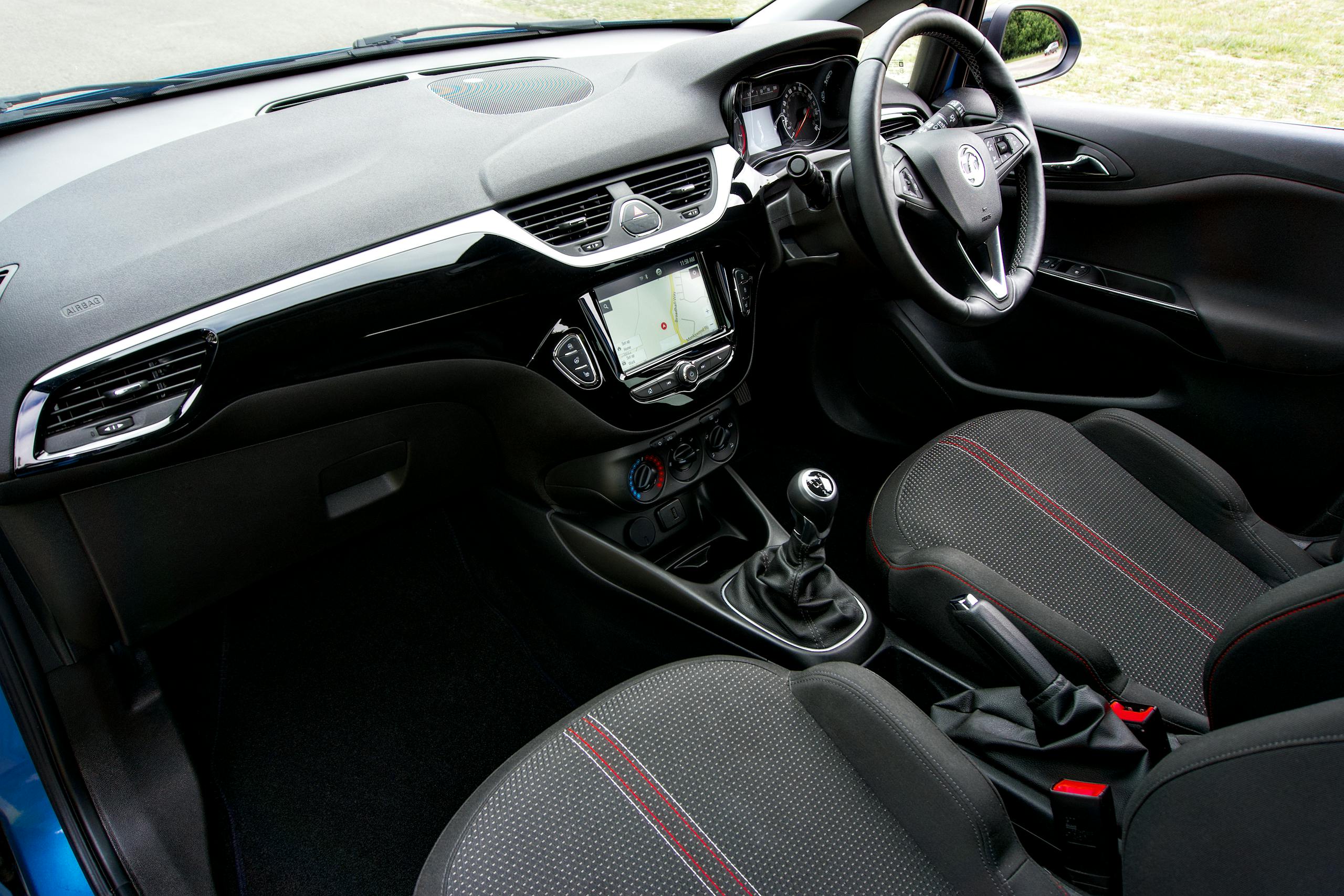 Explore the sleek interior of a Vauxhall vehicle featuring a modern dashboard and comfortable seating.